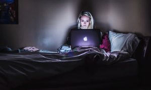 Stressed student working late at night