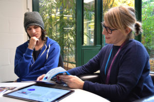 Librarian explaining referencing to a student