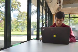 Student using a laptop in the Library