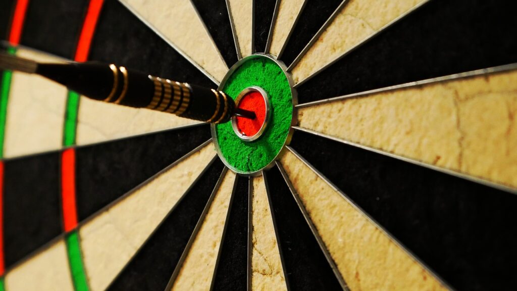 Dartsboard - bullseye being scored by a dart.  From Pixabay - https://pixabay.com/photos/dart-steel-tip-dart-bullseye-5864763/