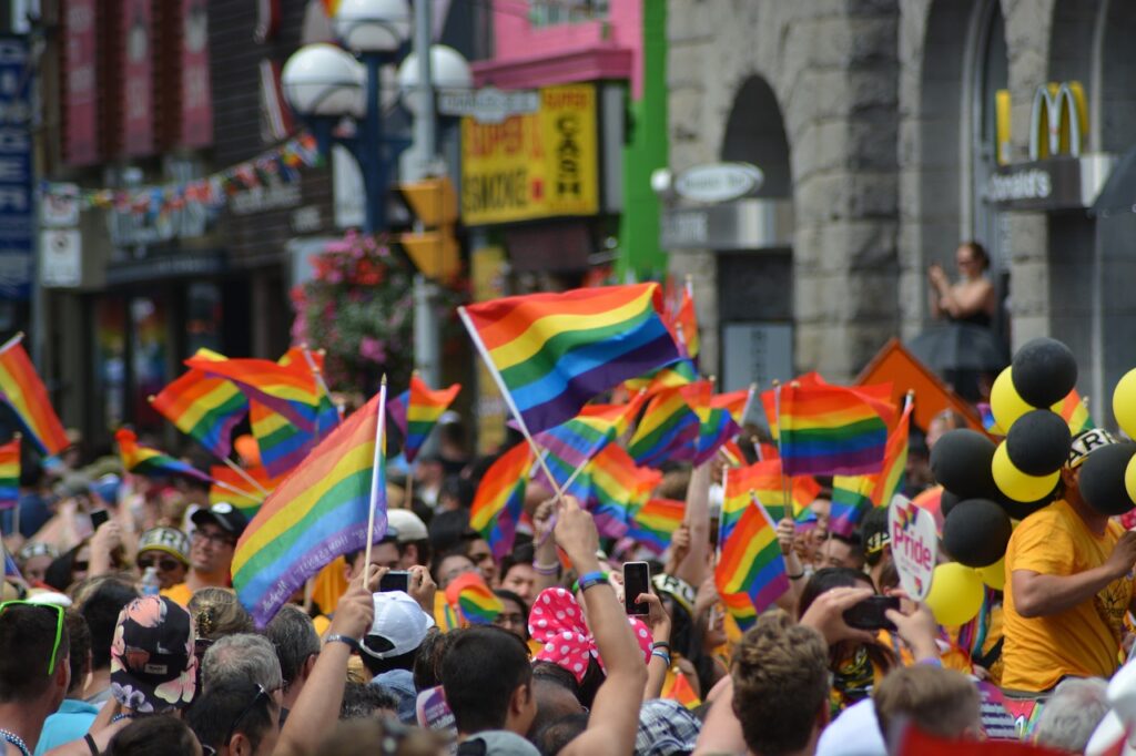 Pride march - a sea of rainbow flags are being waved
