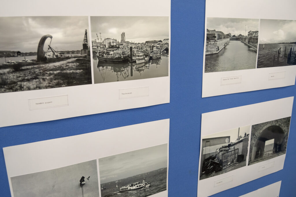 Section of the Serenissima of the South Coast photography exhibition: black and white photographs juxtaposing scenes of prosperity and decay around Portsmouth